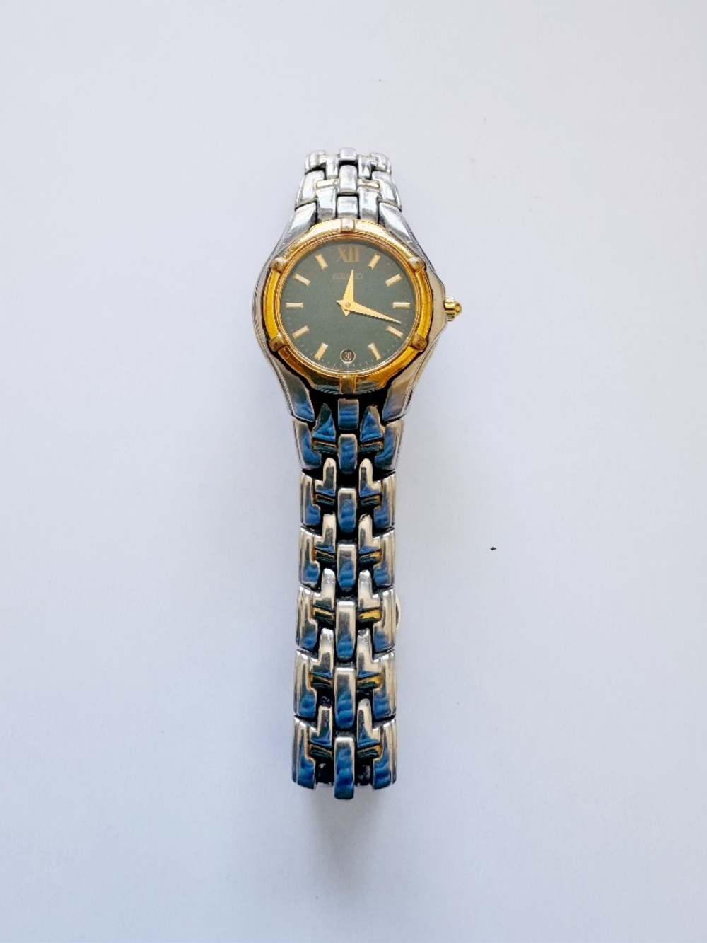 Seiko Women's Two-Tone Quartz Watch 25mm Black & Gold Dial Date V789 6.75 Inch⁠